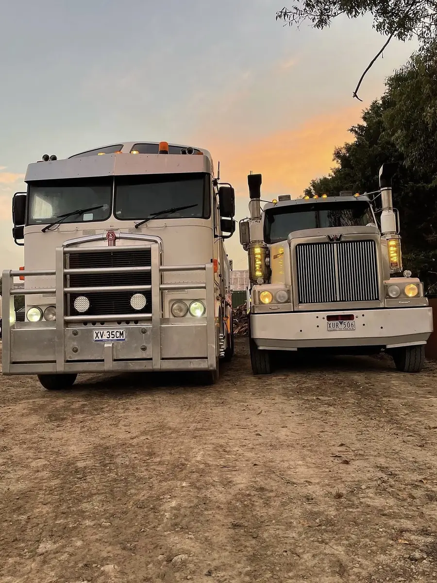 Prime movers parked on site at sunset