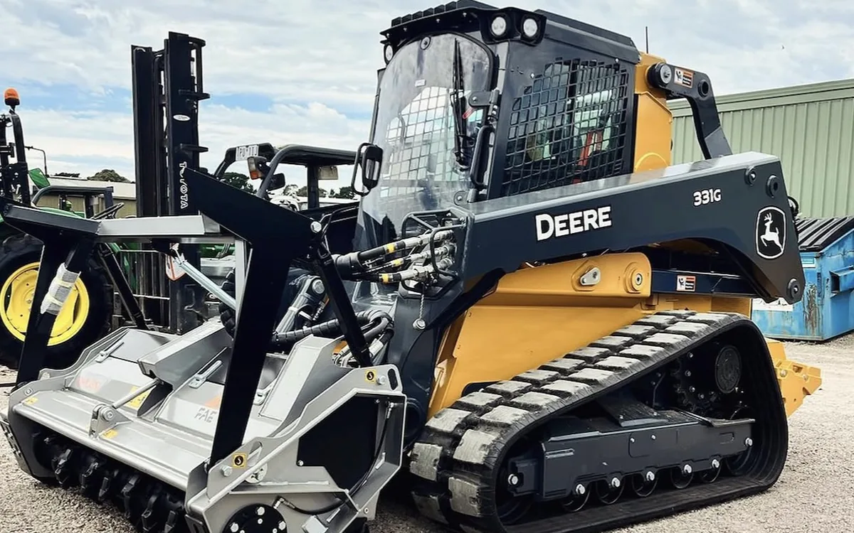 John Deere tracked skid steer fitted with an FAE forestry mulcher head
